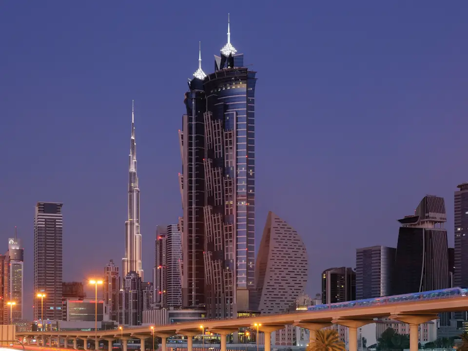 JW Marriott Marquis Hotel Dubai, United Arab Emirates exterior view at sunset.