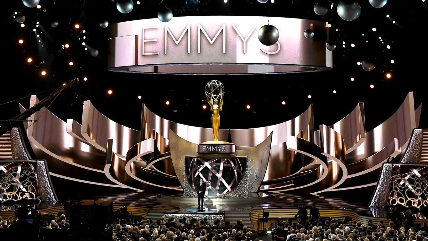 The Emmy Awards Experience - Emmy stage with silver accents and crowd of celebrities