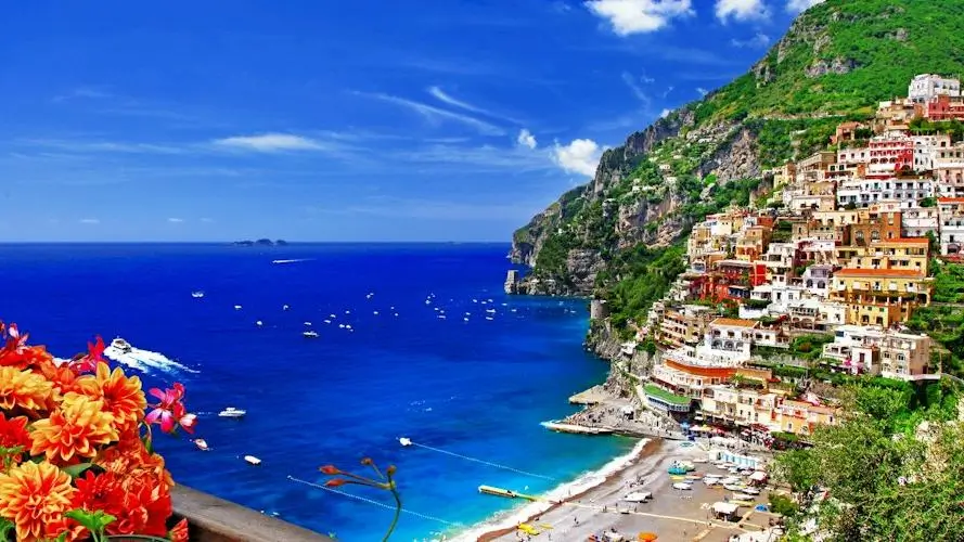 Stunning Amalfi Coast view featuring the picturesque town of Positano overlooking the sea.
