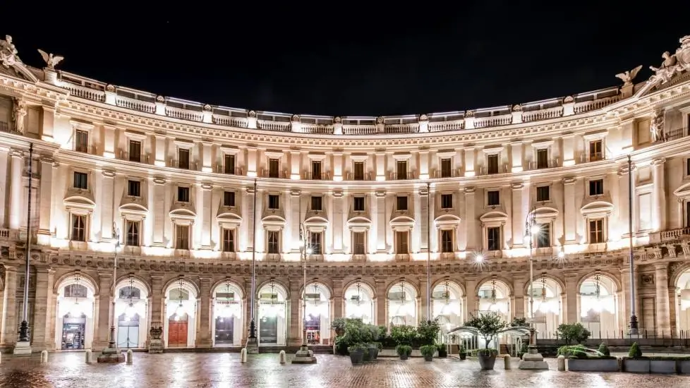 Boscolo Exedra Roma, Autograph Collection exterior view at night with dramatically lit columns