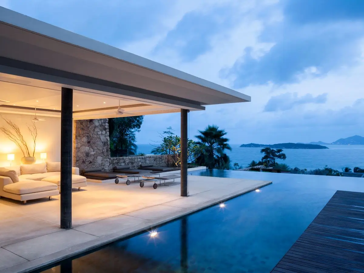 A magnificent pool view at a luxury vacation home overlooking the ocean. 