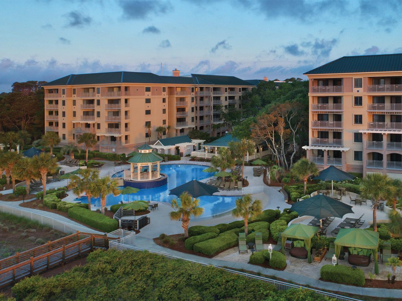 Exterior of Marriott's Barony Beach Club timeshare location showing pool pergola