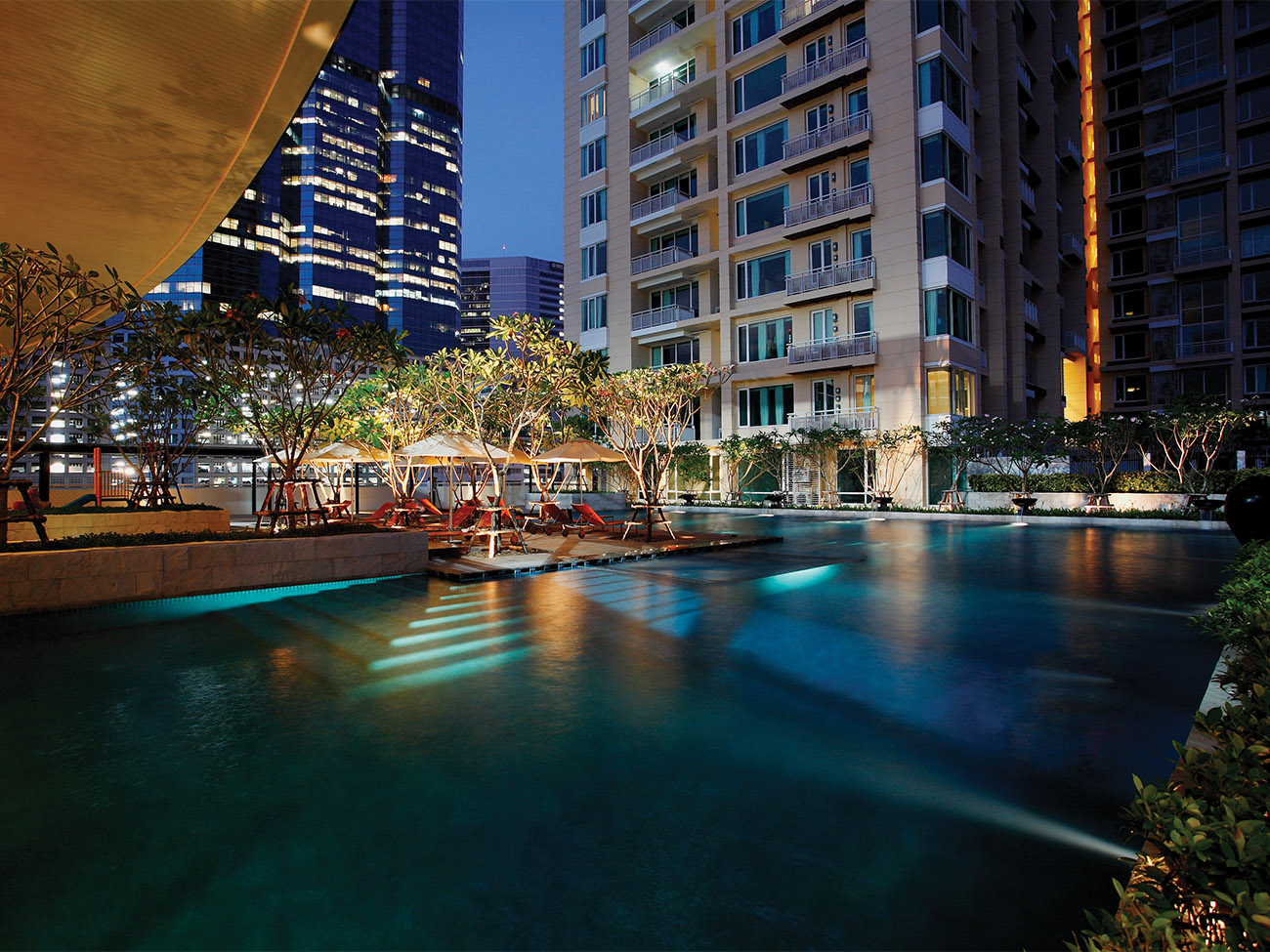Exterior at night showing pool at Marriott Vacation Club at The Empire Place urban resort timeshare