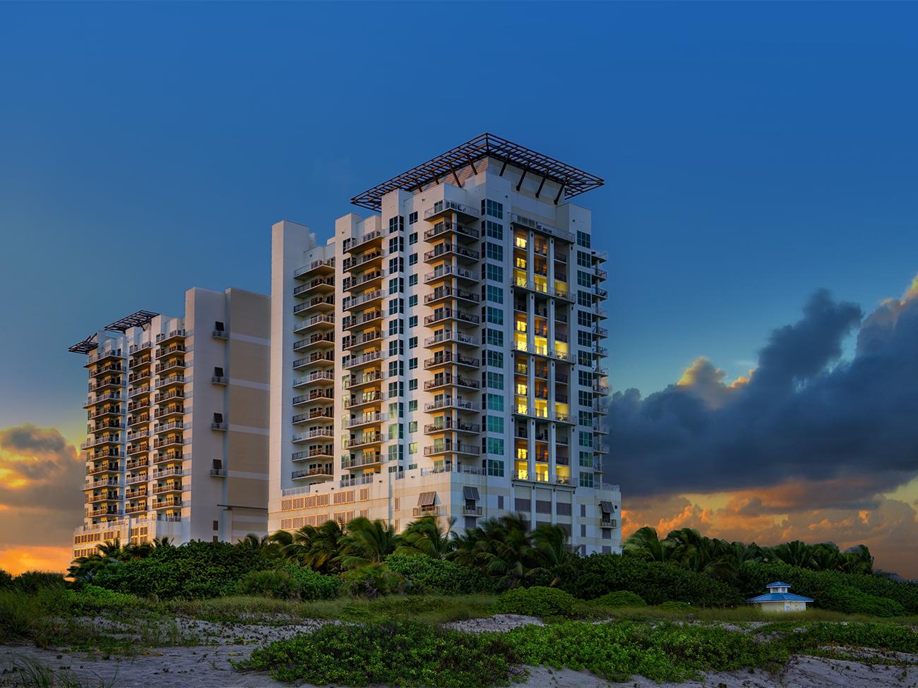 Exterior of Marriott's Oceana Palms timeshare resort amid natural beach dunes